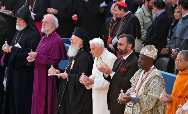 (From L) The first Primate of new Armenian diocese of France Norvan Zakarian, the archbishop of Canterbury  Rowan Douglas Williams, the Greek Orthodox church patriarch Bartolomew I, Pope Benedict XVI, the representative for Israel Rabbi, Rabbi David Rosen, the President and Founder of the Ifa Heritage Institute Professor Wande Abimbola and the representative for the Hinduism religioon Acharya Shri Shrivasta Goswani hold lamps during a prayer at the interreligious talks on October 27, 2011 at San Francisco basilica in Assisi. Pope Benedict XVI leads during the day the 25th Interreligious talks, a "journey of reflection, dialogue and prayer for peace and justice in the world" held in St. Francis of Assisi's birthplace, with four leading atheist intellectuals taking part for the first time.  AFP PHOTO / ALBERTO PIZZOLI (Photo credit should read ALBERTO PIZZOLI/AFP/Getty Images)